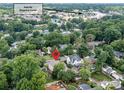 Aerial view of the neighborhood, near Park Road Shopping Center, surrounded by lush greenery at 3227 Pinehurst Pl, Charlotte, NC 28209