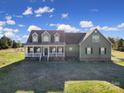 Exterior elevation of a well-maintained home featuring traditional architecture, lush lawn, and beautiful windows at 3798 Red Doc Rd, Lancaster, SC 29720