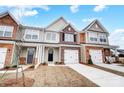 Newly built townhome with brick and shingle exterior and 2-car garage at 4153 Black Ct # 173, Harrisburg, NC 28075