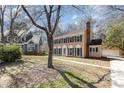 Beautiful two-story home with shutters, a spacious yard, and a detached garage at 5328 Caradon Dr, Charlotte, NC 28227