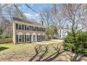 Inviting two-story home with shuttered windows and well-maintained front yard landscaping at 5328 Caradon Dr, Charlotte, NC 28227