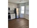 Updated kitchen featuring stainless steel refrigerator and wood-look flooring at 2623 Trumpet Ct, Fort Mill, SC 29715