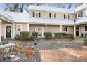 Front view of charming townhome with brick walkway at 3706 Selwyn Farms Ln # 17-3, Charlotte, NC 28209