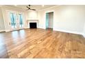 Living room with hardwood floors, fireplace, and access to patio at 2971 Alveston Nw Dr # 29, Concord, NC 28027