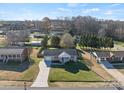 An aerial view of the house showing the driveway and neighborhood at 2505 Ashford Dr, Newton, NC 28658