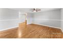 Hardwood floors and ceiling fan in living room at 4264 C & B Farm Rd, Conover, NC 28613