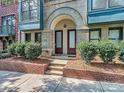 Townhome entry featuring double doors and a brick walkway at 658 E 10Th St, Charlotte, NC 28202