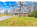 Brick ranch house with carport and spacious yard at 7006 Penndale Dr, Shelby, NC 28152