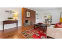 Living room with hardwood floors, a fireplace and large windows at 610 Crescent Cir, Kings Mountain, NC 28086