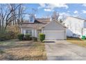 Charming home with dormer windows, manicured bushes and a two-car garage at 6707 Brachnell View Dr, Charlotte, NC 28269