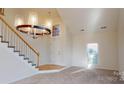 Bright entryway with staircase and wood flooring at 7031 Walton Heath Ln, Charlotte, NC 28277