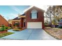 Two-story brick home with driveway and landscaping at 7031 Walton Heath Ln, Charlotte, NC 28277