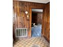 Hallway with wood walls and vintage tile floor at 111 James Love School Rd, Shelby, NC 28152