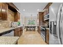 Eat-in kitchen with granite countertops and stainless steel appliances at 1490 Kensington Park Ct, Hickory, NC 28602