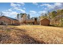 Large backyard with mature trees at 1601 Bennington Nw Dr, Concord, NC 28027