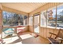 Cozy screened porch with seating and access to backyard at 1601 Bennington Nw Dr, Concord, NC 28027