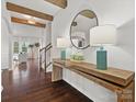 Bright entryway with wood console table, mirror, and hardwood floors at 17718 Snug Harbor Rd, Charlotte, NC 28278