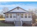 Cute bungalow with updated exterior and inviting front porch at 304 Gold Hill Ave, Rockwell, NC 28138