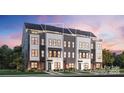 Charming townhome exterior featuring a mix of gray and white siding, complemented by black brick and stylish awnings at 3614 S Tryon St # 18, Charlotte, NC 28217