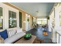 Relaxing front porch with comfortable seating, offering a perfect spot to enjoy the outdoors at 507 W 2Nd Ave, Gastonia, NC 28052