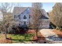 Two-story house with gray siding, attached garage, and landscaping at 625 Circle Trace Rd, Monroe, NC 28110