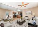 Open living room and kitchen with hardwood floors and neutral colors at 119 Lookout Point Pl, Mooresville, NC 28115