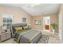 Main bedroom with ensuite bathroom and neutral decor at 119 Lookout Point Pl, Mooresville, NC 28115