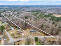 An aerial view of the property with property lines, showcasing its generous lot size in a serene, wooded setting at 2319 Tin Mine Rd, Lincolnton, NC 28092