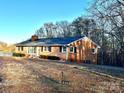 Well-maintained brick home featuring a spacious yard and a long driveway for plenty of parking at 2319 Tin Mine Rd, Lincolnton, NC 28092