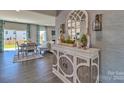 Inviting dining area with stylish decor, hardwood floors, and a seamless transition to the living room at 320 Coronado Ave, Matthews, NC 28104