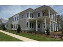Charming home with covered porch, landscaped lawn, and classic architectural details at 7392 Deer Hollow Rd # 27, Sherrills Ford, NC 28673
