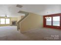 Spacious open-concept living room featuring a cozy fireplace and ample natural light, ideal for entertaining guests or relaxing at 1114 Fenwick Ct, Clover, SC 29710