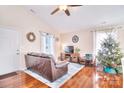 Bright and airy living room with hardwood floors, cozy furnishings and plenty of natural light at 3076 Champion Sw Ln, Concord, NC 28025
