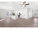 Open concept kitchen with stainless steel appliances, granite countertops, and white cabinetry at 3250 Maple Ridge Dr, Gastonia, NC 28052