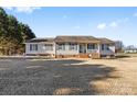 Ranch house with green shutters and a covered porch at 135 Rumple Hill Dr, Statesville, NC 28677