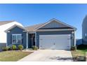 Charming single-story home features a two-car garage and inviting entrance at 138 Gray Willow St, Mooresville, NC 28117