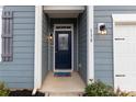 Blue house exterior with a navy front door and landscaping at 138 Gray Willow St, Mooresville, NC 28117