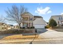 Two-story house with beige siding, a large garage, and landscaping at 160 Millen Dr, Mooresville, NC 28115