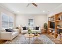 Cozy living room features a striped rug, comfortable seating, and a bookshelf with TV at 309 S Ransom St, Gastonia, NC 28052