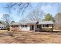 Charming one-story home with a metal roof, brick accents, and a well-maintained yard at 440 Providence Rd, Lancaster, SC 29720