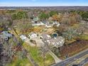 Aerial view of a house and expansive lot with mature trees at 8478 Rocky River Rd, Harrisburg, NC 28075