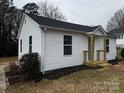 Charming single-story home with white siding, a new front porch, and a well-maintained lawn at 112 Mccray Ave, Kannapolis, NC 28081