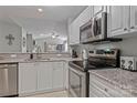 Modern kitchen featuring stainless steel appliances and granite countertops at 751 Southwest Dr, Davidson, NC 28036