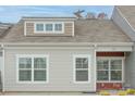 Close up of the front of the townhome, showing the dormer window and front door at 112 Canina Ln, Indian Trail, NC 28079