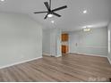 Open living room with hardwood floors and kitchen access at 116 E Maryland Ave, Bessemer City, NC 28016