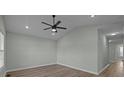 Spacious living room with vaulted ceiling and hardwood floors at 116 E Maryland Ave, Bessemer City, NC 28016