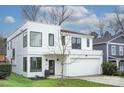 Modern white two-story home with a spacious garage and well-manicured lawn at 1220 Lomax Ave, Charlotte, NC 28211