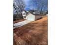 Two-story house with a driveway and a large yard, viewed from above at 1608 Cole St, Gastonia, NC 28054