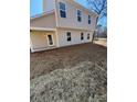 Exterior view of the home's backyard, ready for landscaping and outdoor enjoyment at 1608 Cole St, Gastonia, NC 28054