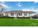 Charming single-story home with well-maintained lawn, tasteful shutters, and attached carport at 1976 Mcilwain Rd, Lancaster, SC 29720